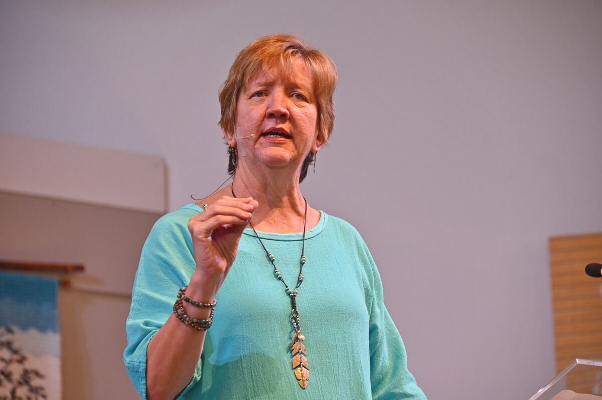 Rev. Robin Reiter speaking, mid-gesture